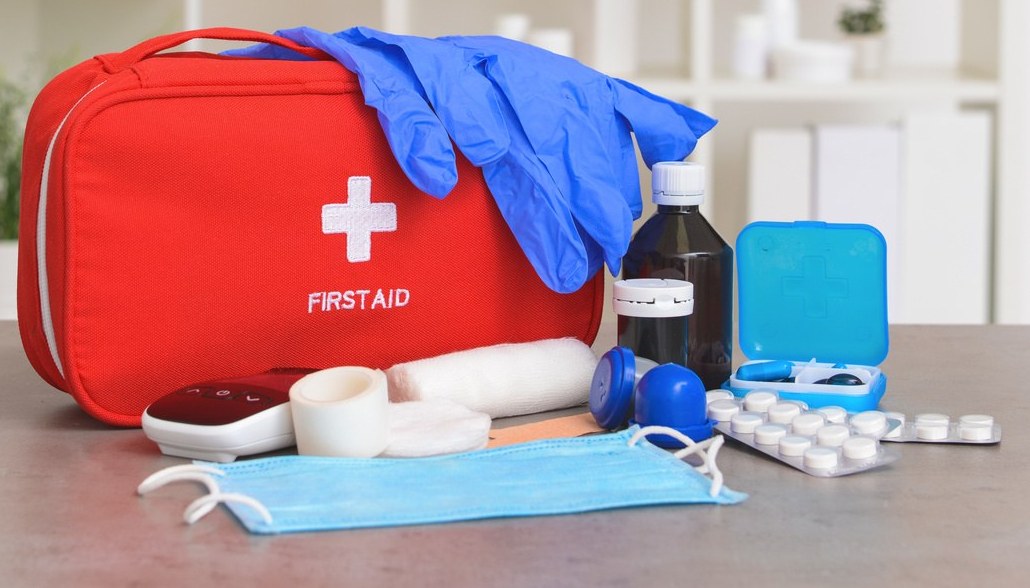 First aid kit with gloves, bandages and supplies